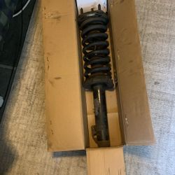 Front Left Strut Off A 2005 Jeep Cherokee 