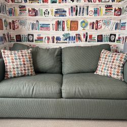 Full Size Sleeper Sofa with Patterned Cushions in Excellent Condition