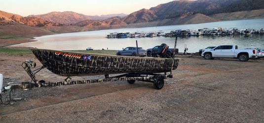 14 ft aluminum boat with a 2 stroke Mercury 5hp