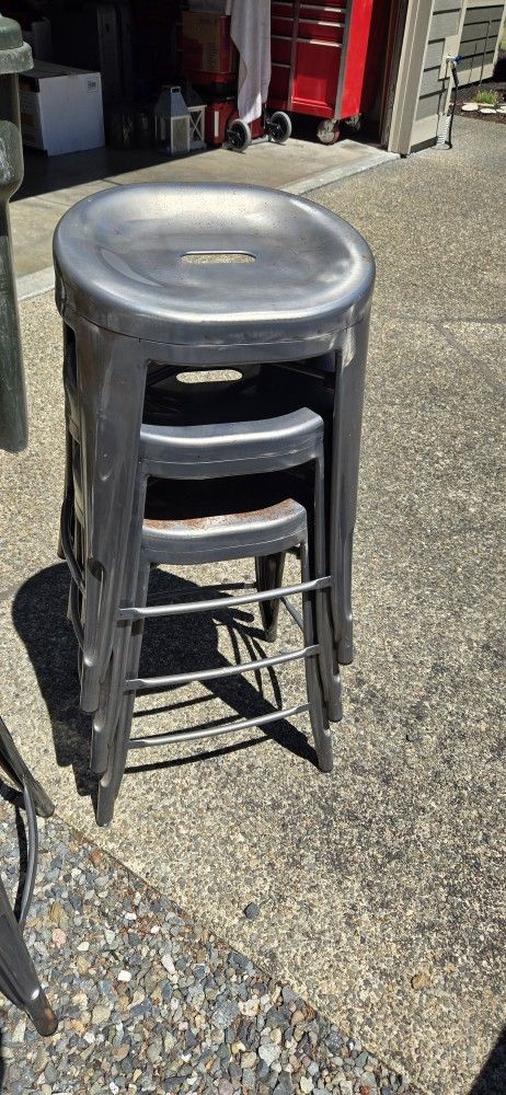 Set of four matching Metal bar stools that stack