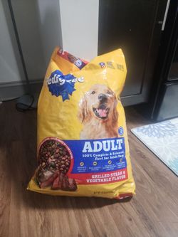 Un opened 18lb bag dog food