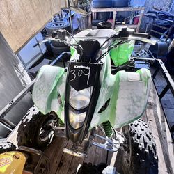 Kawasaki quad and Honda quad