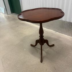 Replica plantation mahogany table  26 inches high 23 inches diameter…$150