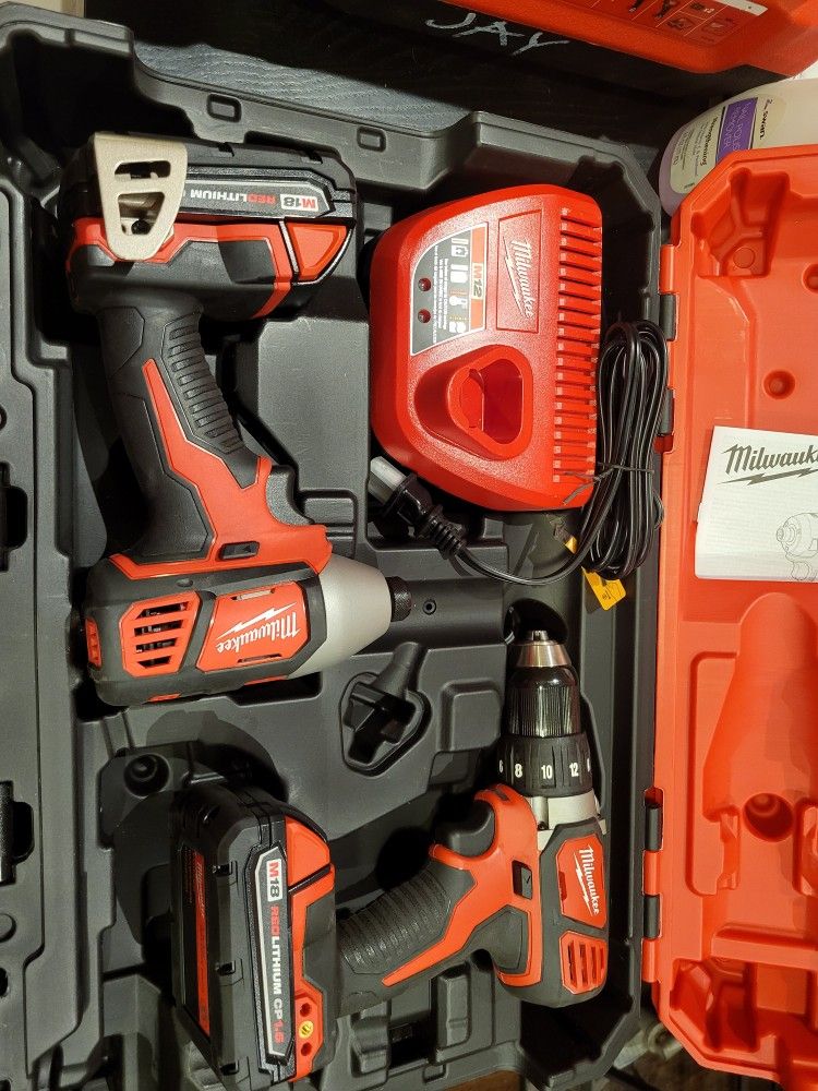 Drill/driver 1/2. Impact driver 1/4 and m12 charger. Both tools come with m18 batteries