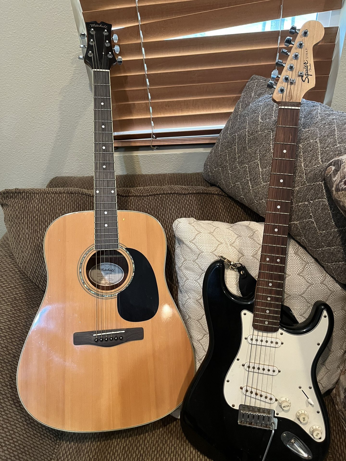 Squier Strat And Mitchell Acoustic Guitars 