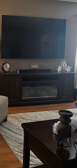 Entertainment console with fireplace