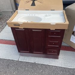 36.5 in. W x 18.75 in. D x 34.375 in ** Home Decorators Collection Sedgewood Single Sink Bath Vanity in Dark Cognac with Arctic Solid Surface Top 