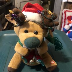 Adorable Battery Operated Reindeer That Sings And Lights Up