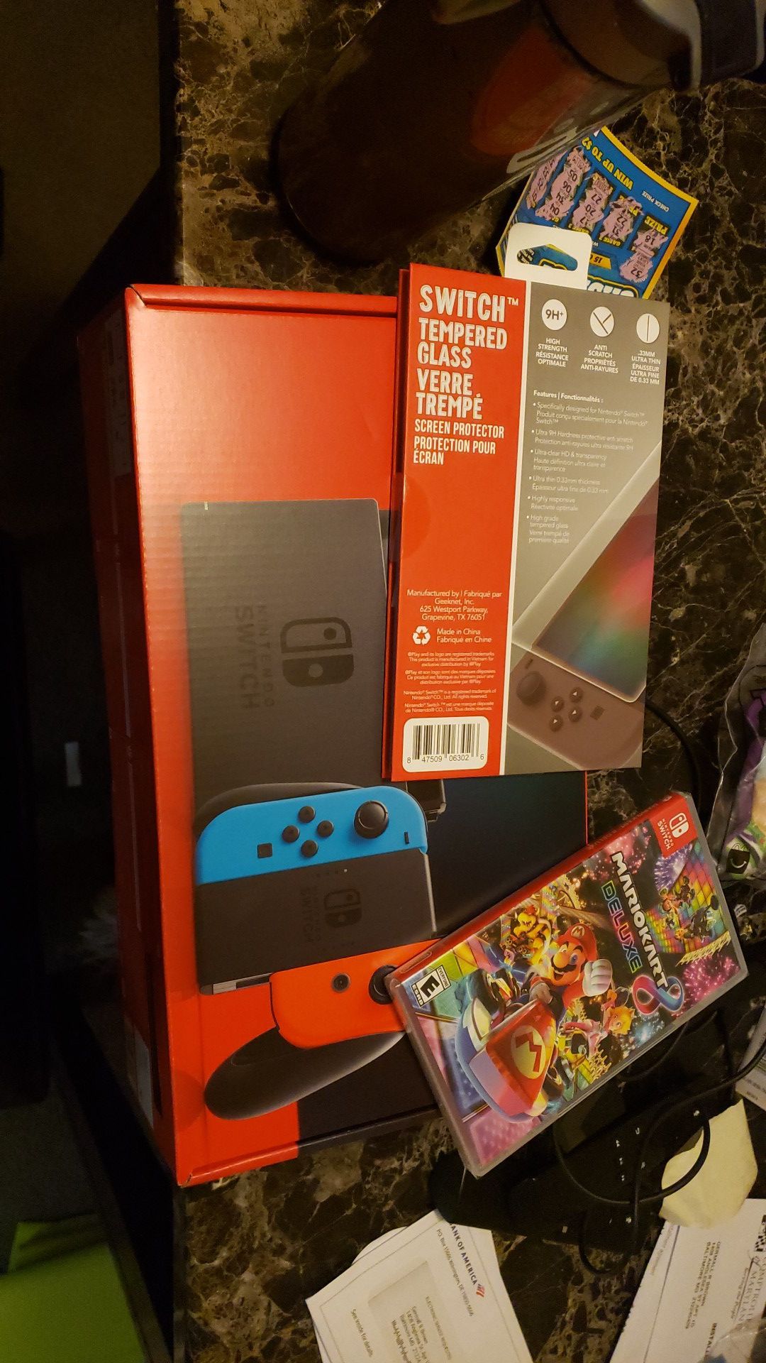 Nintendo Switch with blue and red joycons. $500 comes with mario kart and screen protector. You can also add games from my other listing.