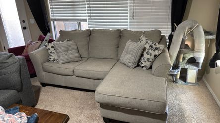 Grey sofa with built in ottoman