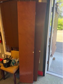 2 brown wood bifold Doors