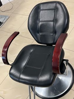 Hair cutting chair reclines to wash hair