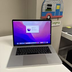 Apple 15” MacBook Pro Touch Bar Retina 2.9ghz Quad Core i7 16GB RAM 512gb Flash 2GB Dedicated AMD Radeon Pro macOS Monterey 