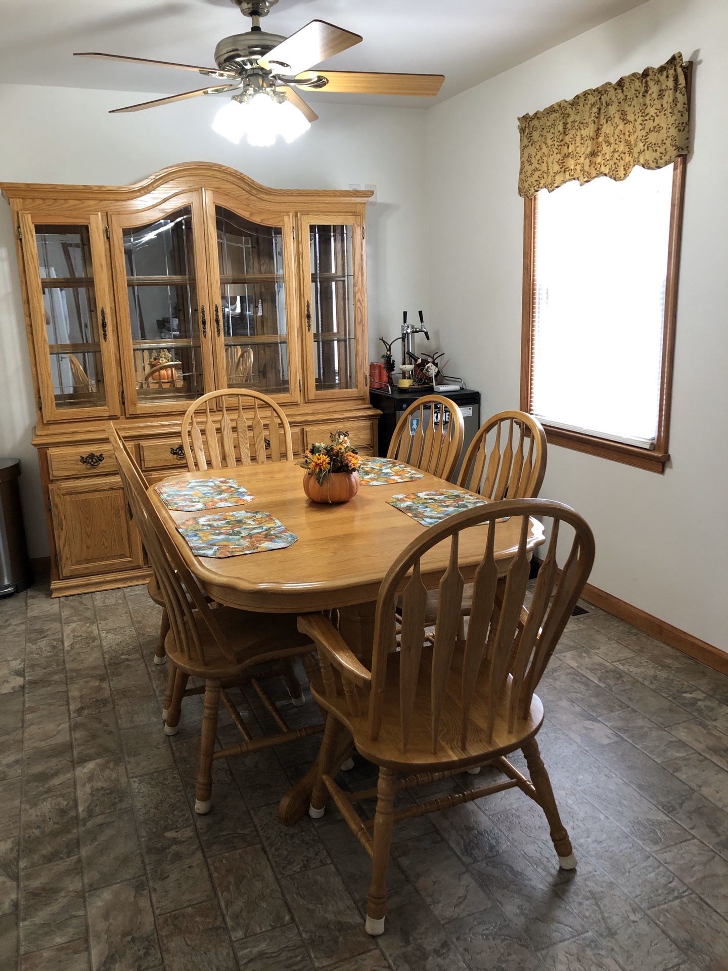 Dining room table with chairs and china cabinet