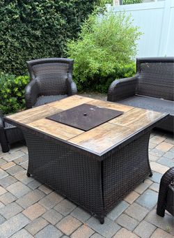 Wicker and tile has fire pit