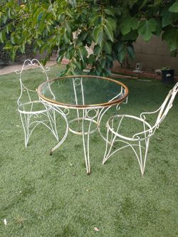 Vintage wrought iron patio set, glass top and 2 chairs