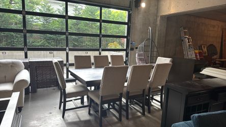 8 person wood dining table and upholstered chairs