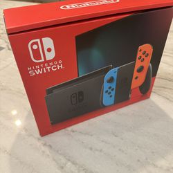 Brand New - Never Opened - Nintendo Switch with Neon Blue and Neon Red Joy-Con
