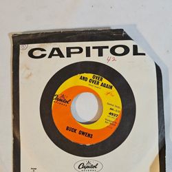 Buck Owens Act Naturally, Over And Over Again 4937 45 Vinyl Capitol Records 1963 With Cover The product is a 45 RPM vinyl single by artist Buck Owens,