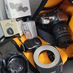 Canon camera with original Canon battery grip ,Macro lens, ring flash, charger, 2 batteries, bag, extra lens and more