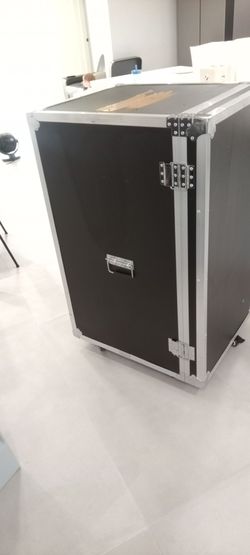 Heavy duty road / freightcase with metal edges and corners also has five Wheels for for transportation one to swing the front door open.