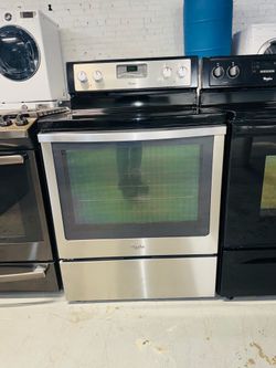 Whirlpool stainless steel electric stove—includes a receipt for a 90-day warranty.