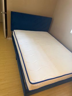 Blue bed frame and mattress
