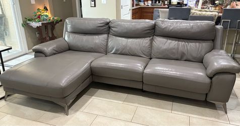 Gray Leather Sectional Sofa with Chaise other side is a powerrecliner with  head recliner