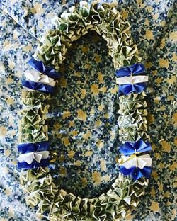 Graduation leis, money crowns, money and flower leis