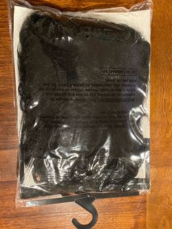 Black Costume Wig in Original Packaging