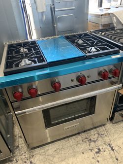 Wolf 36” slide in range with middle grill in stainless steel all gas