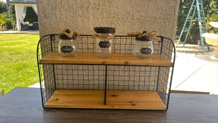 rustic farmhouse-style wall shelf features a black metal wire frame
