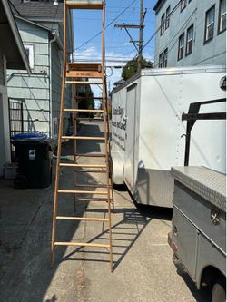 12 ft to platform wooden step ladder.  Older, but in great shape