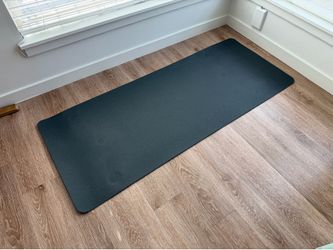 Rubber mat for stationary bicycle or other workouts