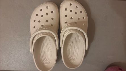 2 pairs of crocs, black/white, size 7 women’s.