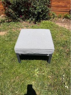 Outdoor Metal Ottoman with Gray Cushion