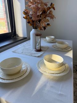 Beautiful white dinnerware with raised floral details. Includes [number] plates and [number] bowls. Condition: [describe any chips or scratches]. Sell