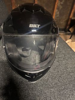Motorcycle helmet it’s black and a bilt brand