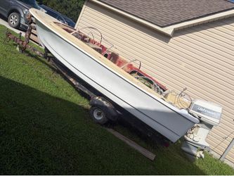 1961 Larson 15 ft boat and trailer.