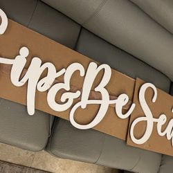 “Sip & Be Seated” Sign