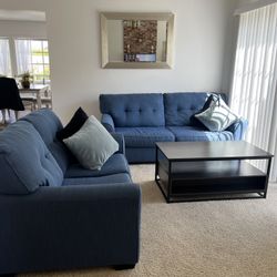 Two Blue Sofas With 4 Cushions