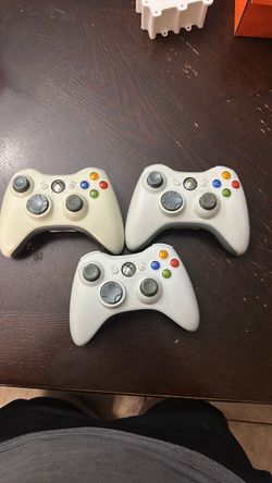 Three original Xbox 360 controllers