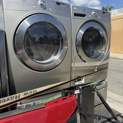 Lg stainless steel washer and dryer set with pedestals
