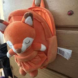 Orange fox back pack with doll