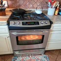 Like New Stainless Steel Gas Stove And Over Counter Microwave 