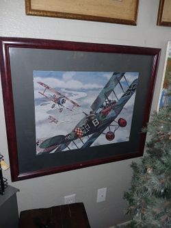 Framed German Fokker Triplane in a dogfight with a British fighter