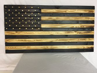 Burnt wood American flag with 9mm shell casing as the stars.