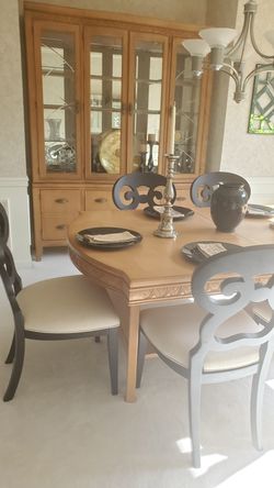 Beautiful dinning room table and chairs and hutch