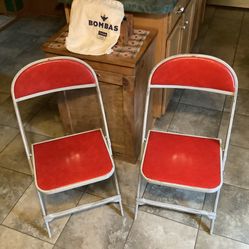 Vintage 1950 pressed metal chairs with padding on both the seat and back. Real deal not the cheap stuff sold today They are made with thick wood on to
