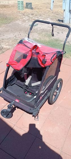 Push cart for 2 kids and bike hookup .
